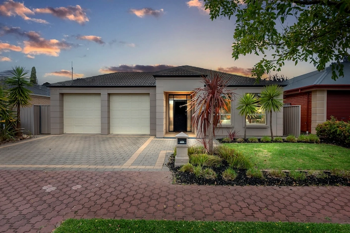 Photo-realistic twilight conversion of a US home with realistic dusk sky and professional light balancing.
