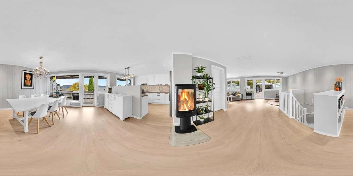 Professional 360 interior panorama of a modern living room and kitchen, featuring seamless stitching.